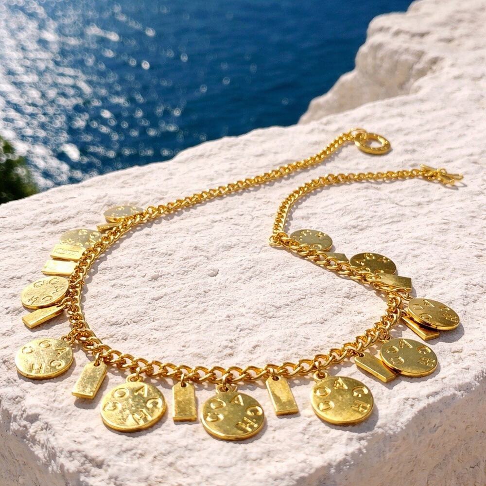 Iconic Coach brand Heavy statement piece Featuring 21 charm medallions. Chunky